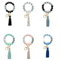 Porte-clé en silicone pour femmes, bracelet, perles, pompon, porte-clés