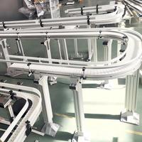 Bande transporteuse industrielle automatique de haute qualité avec emballage en plastique résistant à l'usure pour la ligne de production de boissons et de produits divers