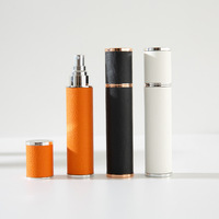En stock – Flacon cylindrique en cuir de 10 ml pour échantillon de parfum, vaporisateur portable, mini flacon vide à pression pour liquides