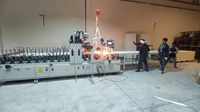 Ligne de production d'emballage intelligente WPC Wide Board MDF Surface PUR Machines à bois