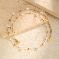 Collier en acier inoxydable plaqué or 18 carats français, vente en gros, élégant collier de perles et bracelet pour femme, bijoux de mariage