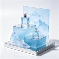 Présentoir en acrylique bleu à niveaux personnalisé en gros, vitrine transparente en acrylique pour parfums et cosmétiques avec base miroir