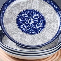 Assiettes en céramique bleues et blanches de style oriental en gros, assiettes à dîner en céramique rétro esthétiques pour la vaisselle des hôtels et restaurants