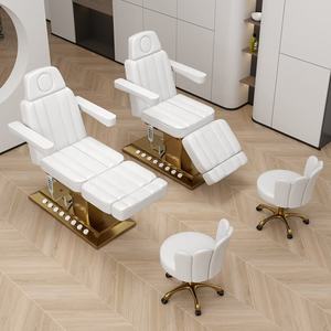 เตียงนวดไฟฟ้าหนัง PU สีขาวหรูหรา ฐานสแตนเลสสีทอง พร้อมมอเตอร์ 4 ตัว สำหรับนวดหน้าและสปา - Product Image 4