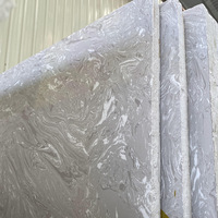 Comptoirs de restaurant sur mesure, meubles, tables, meubles-lavabos de salle de bain, grandes dalles de marbre artificiel gris pour encadrements de portes d'ascenseur