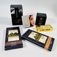 Boîtes d'emballage personnalisées noires et dorées en gros avec impression étoilée et fenêtre découpée pour bougies de massage et chocolats gourmands