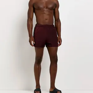 2023 OEM Regular Fit 100% Nylon poliamida bolsillos laterales cintura elástica rojo Regular Fit Swim Shorts ODM - Product Image 1