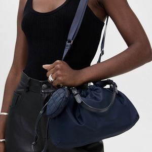 กระเป๋าใส่เหรียญกันน้ำแฟชั่นสไตล์ Preppy ขนาดเล็ก กระเป๋าถือสะพายไหล่เดี่ยวสำหรับผู้หญิง  กระเป๋าเดินทางชายหาดแบบใช้ซ้ำได้ ทำจากไนลอน - Product Image 2