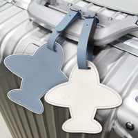 Étiquette de bagage en cuir PU en forme d'avion, étiquette de bagage de voyage anti-perte, étanche, pour carte d'embarquement, design urbain et épuré, vente en gros