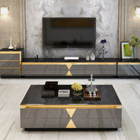 Table basse de salon haut de gamme en verre noir brillant avec tiroirs de rangement incrustés d'or