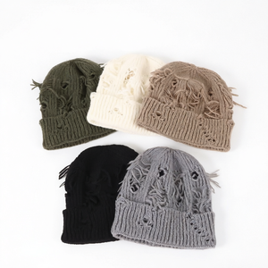 Gorro de punto acrílico desgastado con agujeros, logotipo personalizado, cálido para invierno, gorro tipo calavera acanalado, venta al por mayor de fábrica común, sombrero OEM ODM - Product Image 1