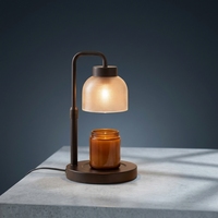 Lampe chauffe-cire en métal noir mat avec bras flexible, abat-jour en verre texturé, base antidérapante et interrupteur latéral