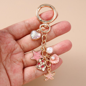 Llavero de lujo con diseño de perlas y temática oceánica, con escamas de sirena, corazón y estrella de mar, para mujer, colgante para bolso, venta al por mayor - Product Image 3