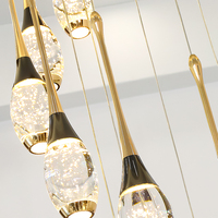 Lustre en cristal doré en acier inoxydable pour villa, escalier intérieur avec design en spirale et utilisation sécurisée, luminaire suspendu moderne pour escaliers