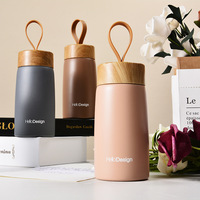 Termo portátil de pequeña capacidad de doble pared frascos de vacío botella de agua de acero inoxidable con tapa de madera