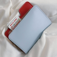 Porte-passeport en cuir PU bicolore tendance 2026 avec étui de voyage multifonctionnel pour cartes et sac de rangement pour billets