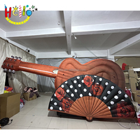 Guitare gonflable modèle d'instruments de musique gonflables géants pour événement musical