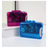 Lecteur de cassettes portable transparent en gros avec engrenages mécaniques visibles, système audio stéréo personnel vintage rétro