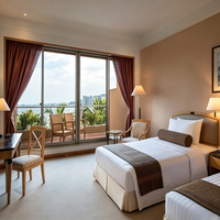 Ensemble de meubles sur mesure pour chambre double d'hôtel : cadre de lit, tête de lit, tables de chevet, bureau et fauteuil de détente pour chambres d'hôtel 5 étoiles