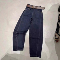 Jeans taille haute pour femme, bleu foncé délavé, coupe incurvée, style urbain, design oversize, ourlet effiloché, vente en gros usine