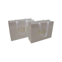 Sac en papier fantaisie pour cosmétiques avec poignées en ruban, logo personnalisé en feuille d'or, idéal pour bijoux et cadeaux