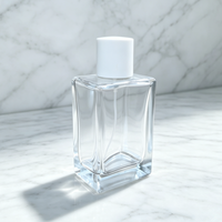 Flacon de parfum de luxe en verre transparent de 100 ml, vide, rectangulaire, cosmétique, avec base lourde et capuchon cylindrique blanc