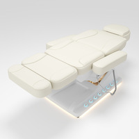 Table de soin esthétique électrique de luxe chauffée à 4 moteurs, pivotante à 360°, avec pédales, pour spa et massage