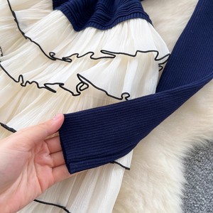 Áo thun GX-2025 với cổ áo đứng và tay áo dài, có thiết kế xếp li cho một cái nhìn giản dị. - Product Image 6