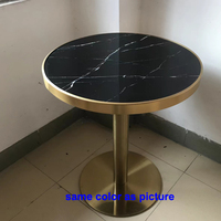 En stock table de café prêt à expédier table de salle à manger ronde de restaurant avec plateau en marbre noir en acier inoxydable doré de bonne qualité