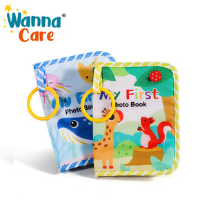 Wanna Care <span class=keywords><strong>Mon</strong></span> Premier Bébé : <span class=keywords><strong>Livre</strong></span> Photo en Tissu en Polyester Doux, Réutilisable, à Suspendre, Album <span class=keywords><strong>de</strong></span> Souvenirs pour Bébé avec Fonctionnalités Musicales - Product Image 1