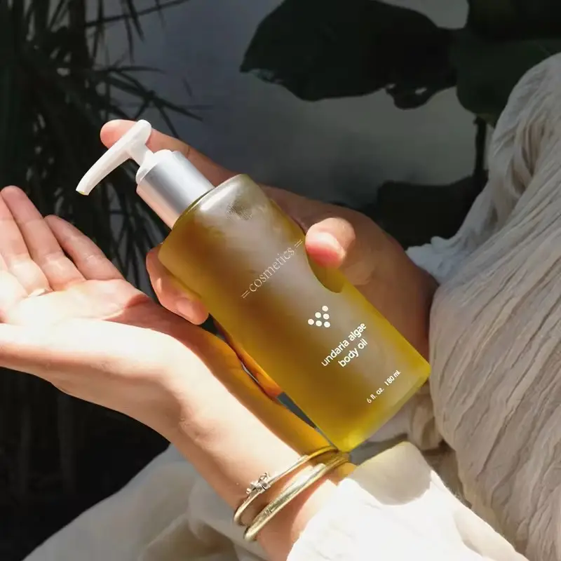 Óleo de massagem corporal de cúrcuma com logotipo personalizado de marca própria vitamina C orgânica ilumina o rosto e o corpo óleo essencial de azeitona fragrância