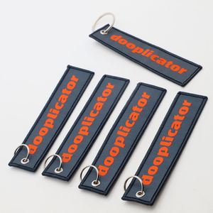 Porte-clés en tissu personnalisé brodé style streetwear pour la marque de vêtements, porte-clés tissé personnalisé avec logo, étiquette jet tag - Product Image 4