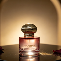 Flacon de parfum en verre rose rond épais de 50 ml, nouveau design, avec bouchon pompe transparent et boîte d'emballage cosmétique ronde verte, vente en gros