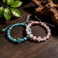 Bracelet artisanal en macramé avec pierres énergétiques (améthyste, quartz rose), perles et croix, ajustable, bijoux spirituels pour la paix intérieure