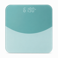 Balance de salle de bain numérique moderne vert turquoise en verre trempé avec affichage LED dissimulé pour pesée personnelle précise à domicile Pro