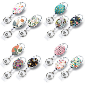 Factory direct UV printed flower oval easy-pull <b>buckle</b> metal back <b>clip</b> pull cord <b>clip</b> name card <b>clip</b> telescopic key ring - Product Image 1