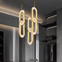 Lustre en cristal personnalisé moderne et créatif Anneau de suspension Long escalier Villa Hôtel Lobby Fournisseur