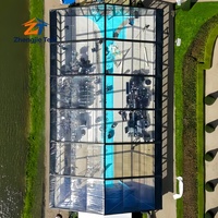 Tente de mariage de luxe avec cadre noir en verre, pavillon transparent pour fêtes en plein air, réceptions et événements de célébration
