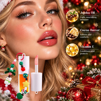 Huile à lèvres bicolore de Noël sous marque privée, avec breloque perlée, brillance intense, hydratante, jojoba, vitamine E, gloss à lèvres en gros