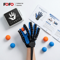 Gants de robot de réadaptation d'entraînement de récupération de doigt de patient d'accident vasculaire cérébral pour l'hémiplégie, paralysie cérébrale
