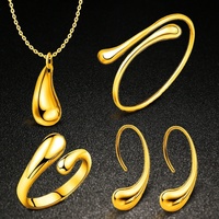Ensemble de bijoux Goutte de pluie quatre pièces : bagues torsadées et gouttelettes avec bracelet en alliage – Cadeau de Noël tendance pour les fêtes