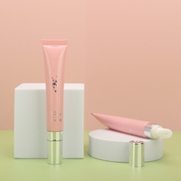 Tube cosmétique en plastique PE estampé à chaud pour crème contour des yeux et baume à lèvres 15g 25g 30g, emballage personnalisé avec tête de massage en céramique plaquée argent