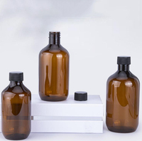Vente en gros 300ml 400ml 500ml PET boston Bouteille ronde Bouteilles ambrées Bouteille en plastique avec couvercle et bouchon noirs