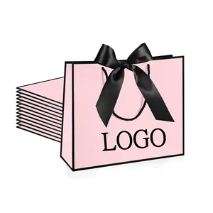 हाई एंड गुलाबी कार्डबोर्ड पैकिंग अवकाश उपहार उत्तम धनुष रिबन हैंडल के साथ गुलाबी लड़कियों का पसंदीदा जन्मदिन ग्रेजुएशन उपहार बैग