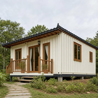Maison modulaire en conteneur résidentiel avec plan à deux étages, murs en verre et balcon