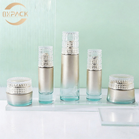 Flacons de soin en verre aqua dégradé argenté de 30 ml, 35 ml, 100 ml, 120 ml avec couvercles en grille de cristal pour essence, huile pour le visage, base de maquillage