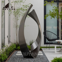 Sculpture abstraite en acier inoxydable sur mesure, grande taille, en forme de ruban, art métallique moderne pour l'aménagement paysager extérieur, statue pour parc, place publique, jardin