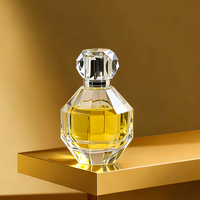 Nouveau flacon de parfum en verre de 100 ml ressemblant à une grenade avec pulvérisateur à pompe, design sérigraphié, emballé dans un carton, couleur personnalisée