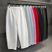 Nouveau pantalon d'hiver vintage couleur unie coupe sabre en molleton épais, style streetwear ample, avec coupe 3D incurvée et effet drapé
