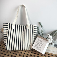 Sac de courses polyvalent à longue poignée en toile de coton rayée avec poche intérieure zippée pour le rangement des fournitures scolaires des étudiants